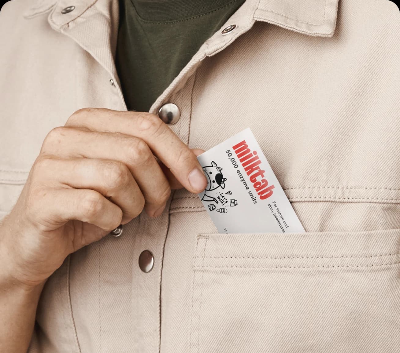 A milktab sleeve slipping into a shirt pocket